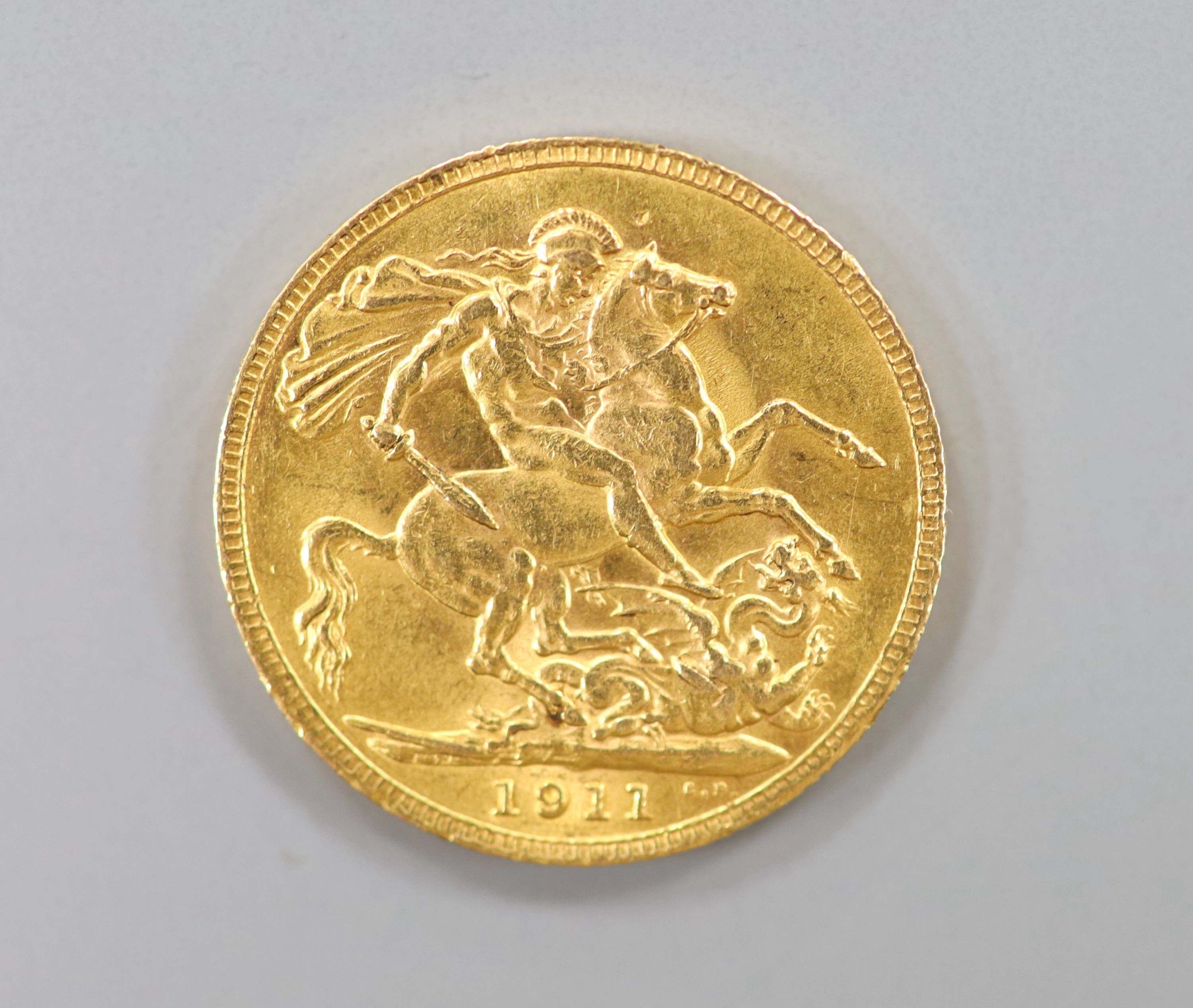 A George V 1911 gold sovereign.